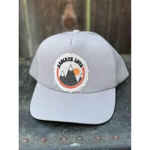 Radiate Love Women’s Trucker Hat with pony holder